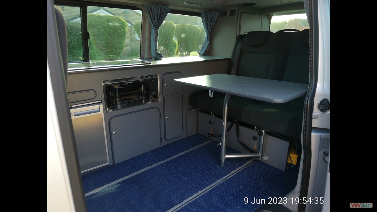 Reimo table on support fitted to seat.